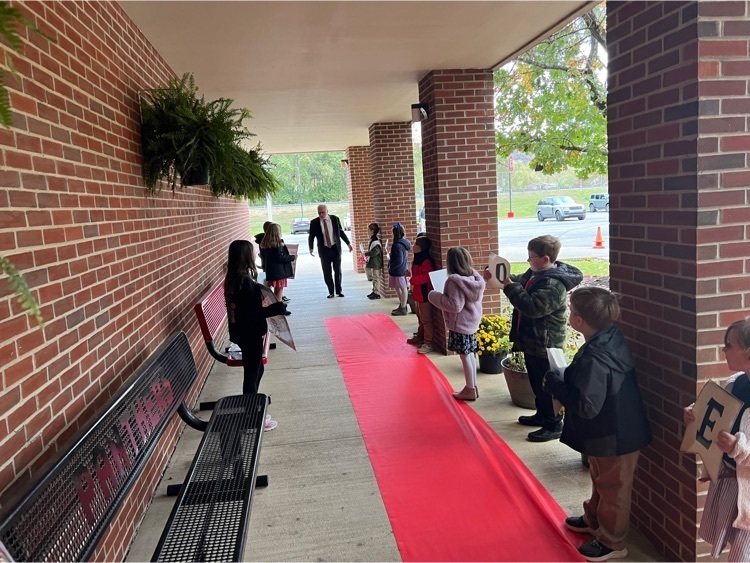 welcoming guests on the red carpet