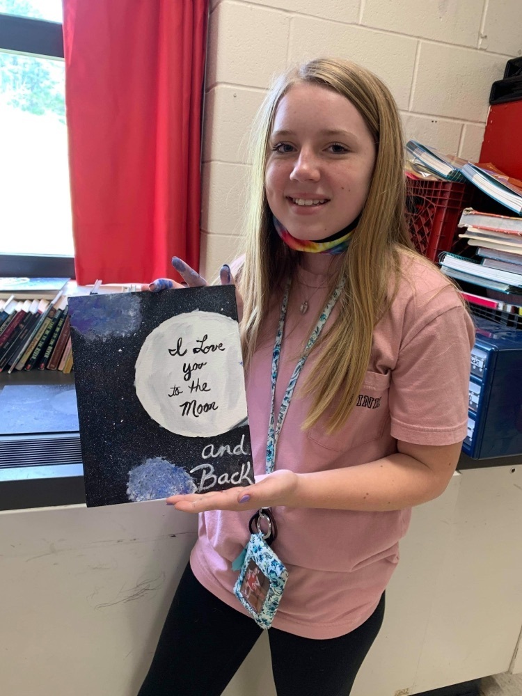 Paytan Adams and her painting.