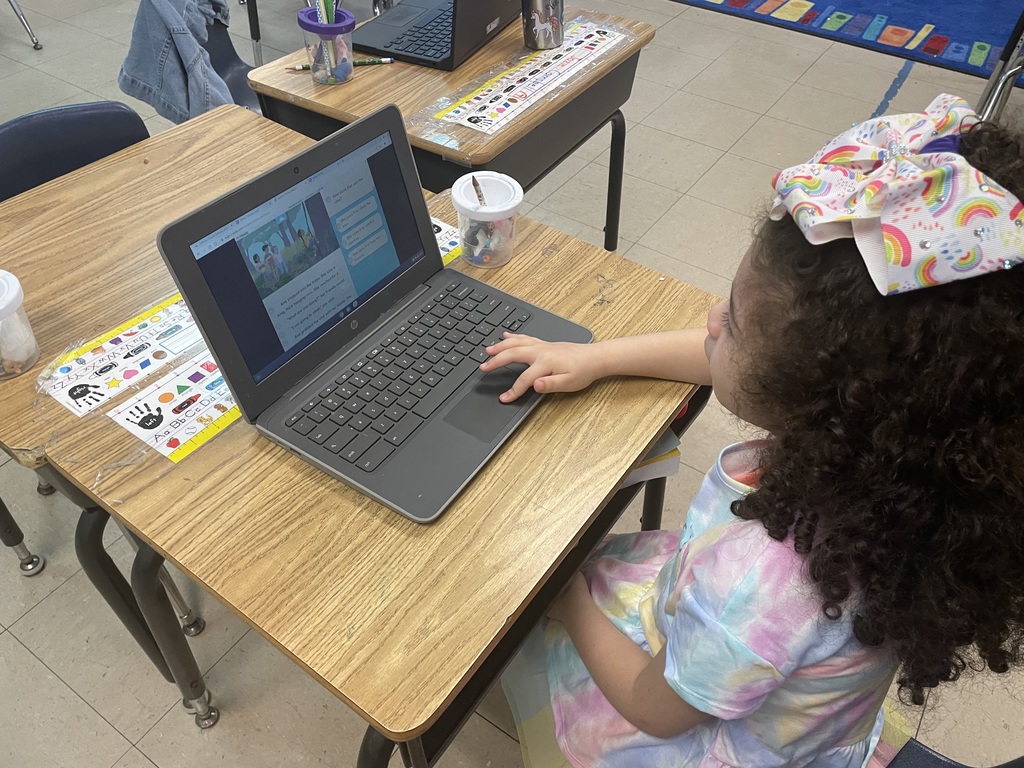 Kindergarten staying busy practicing learning to read.