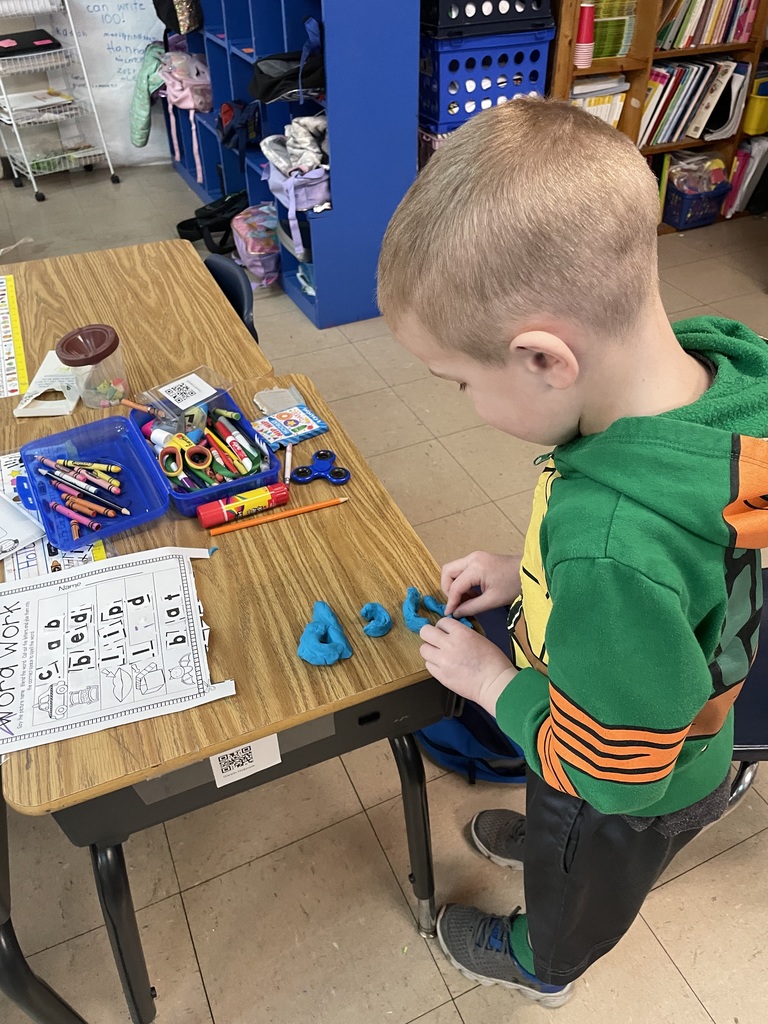 Kindergarten working really hard to learn their spelling words.