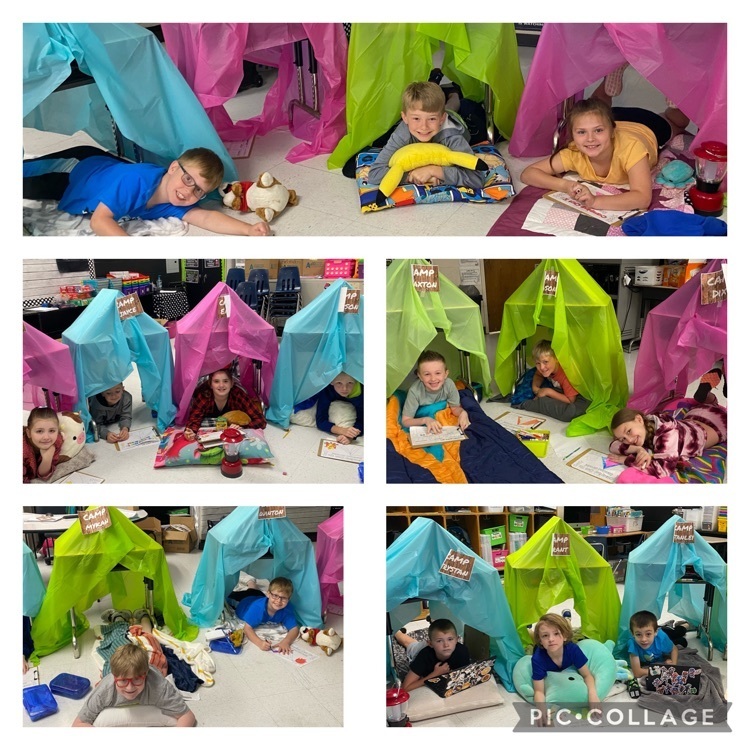 Second grade students in their tents on camping day